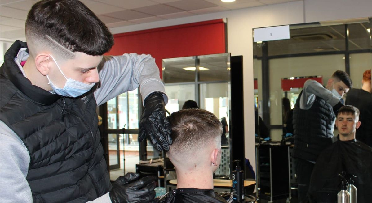 Barbering student Jack Devlin in competition.